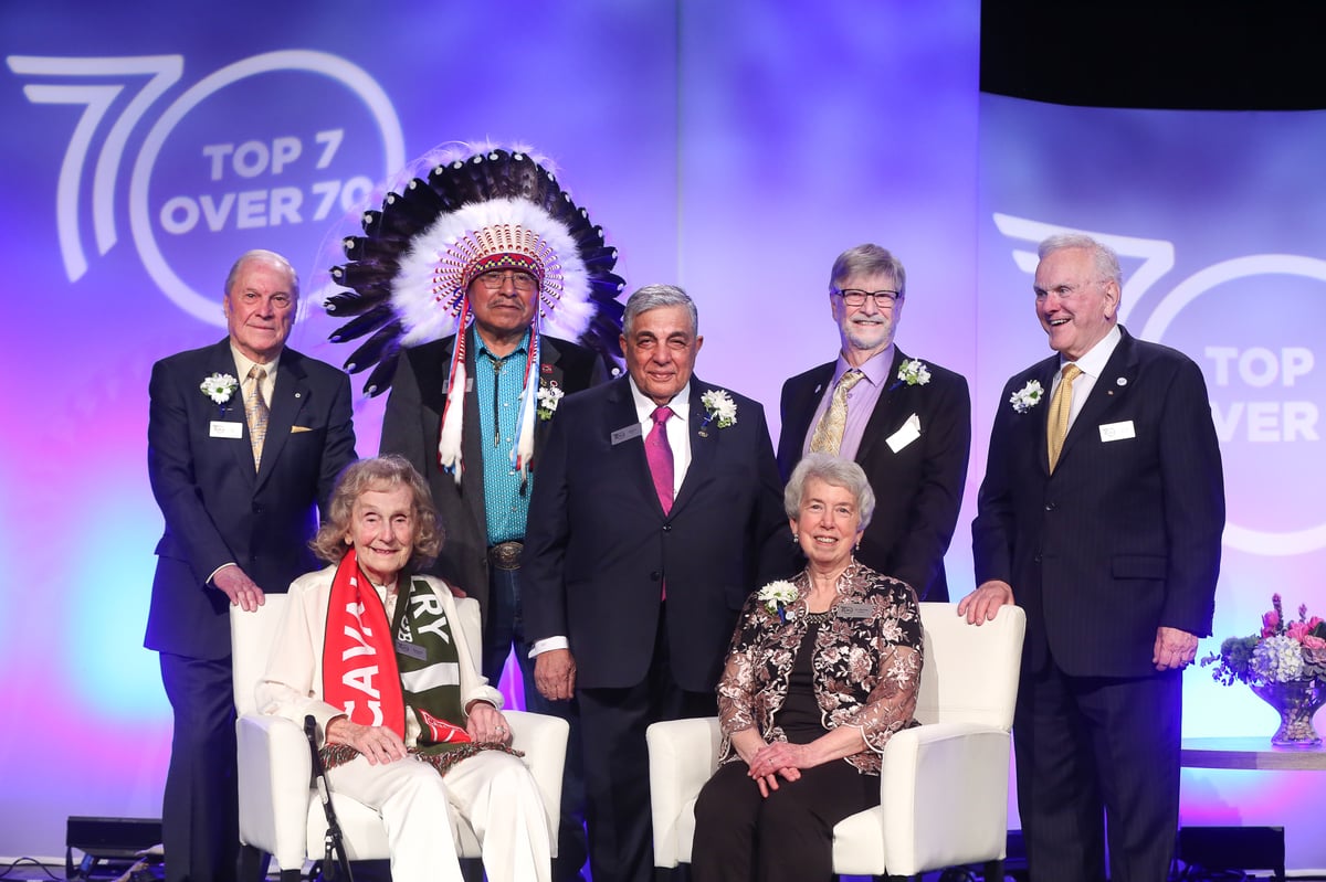 The 2022 Top 7 Over 70 winners: Front row, seated: Marg Southern and Bonnie Kaplan; Back row, left to right: Don Taylor, Miiksika'am (Elder Clarence Wolfleg), Sherali Saju, Louis B. Hobson and Murray McCann.